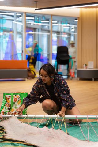 Lacing up the moose hide to cure