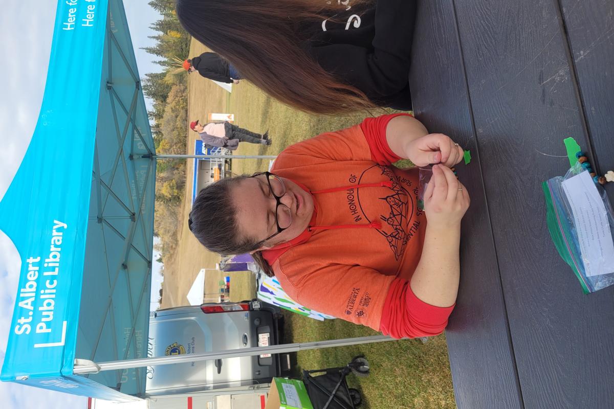 SAPL's Emily Baxter beading with the community